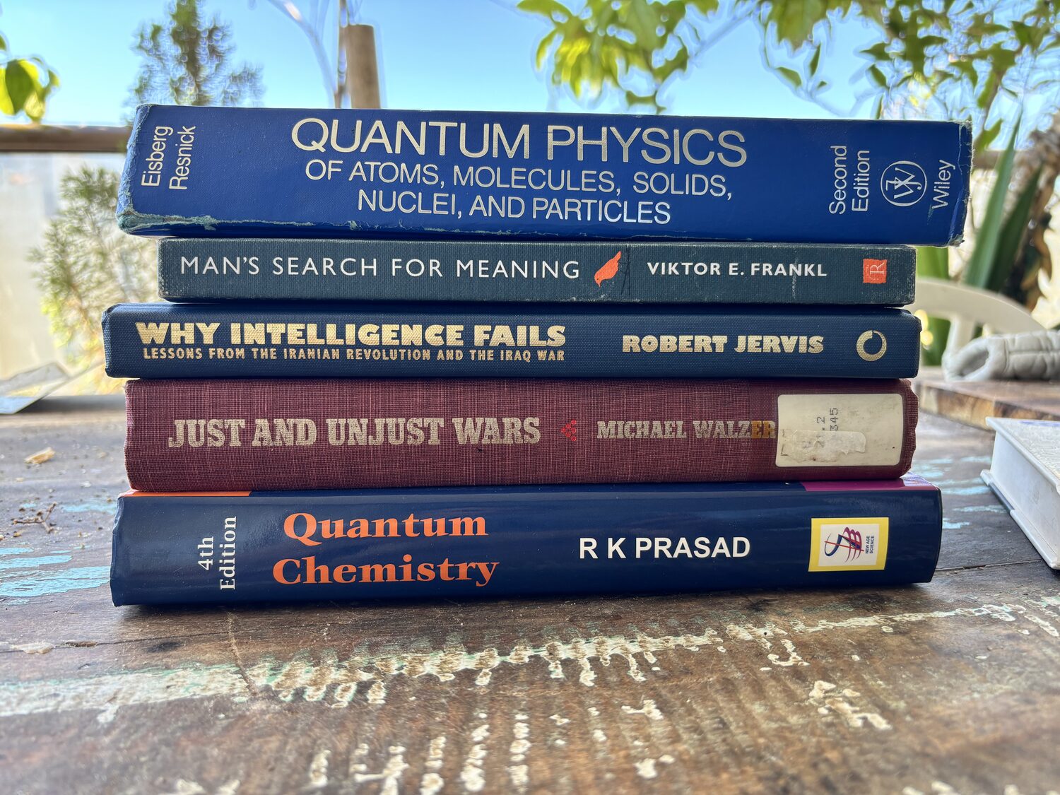 Books on quantum physics, intelligence analysis, and just war theory